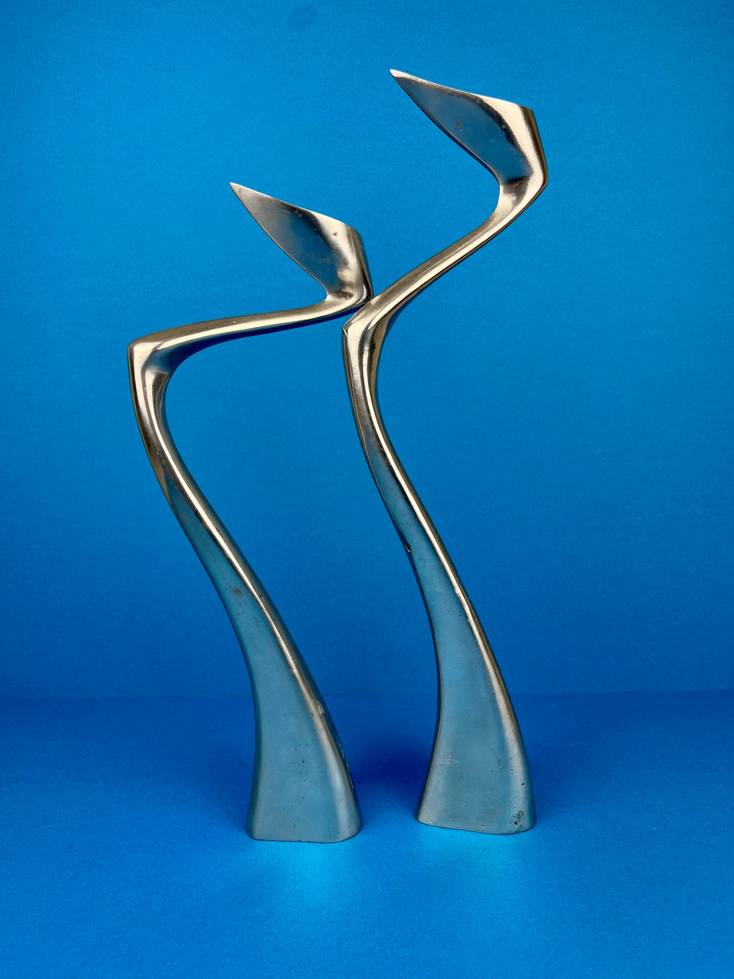 PAIR OF MATTHEW HILTON 'SWAN' CANDLE HOLDERS