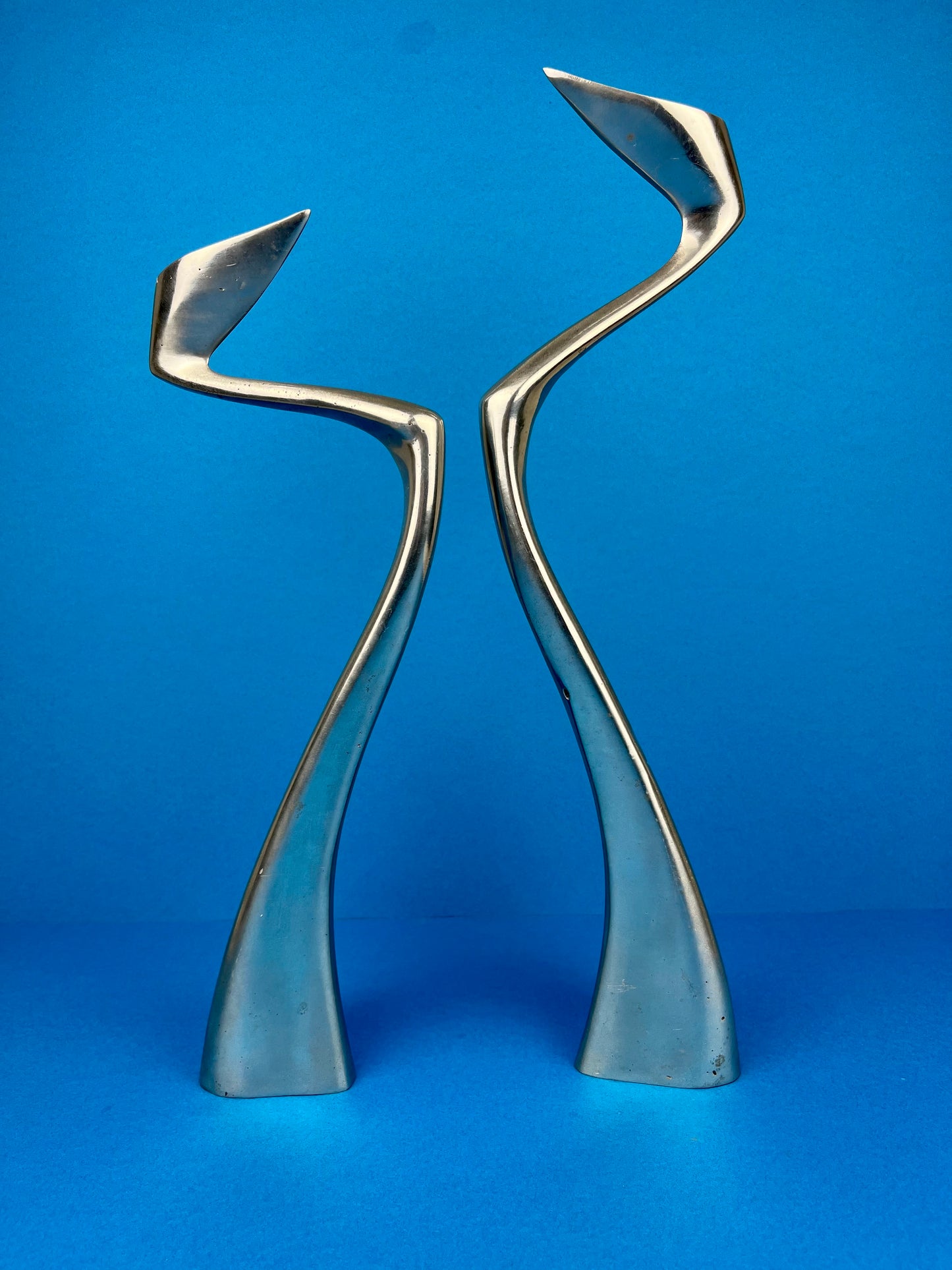 PAIR OF MATTHEW HILTON 'SWAN' CANDLE HOLDERS