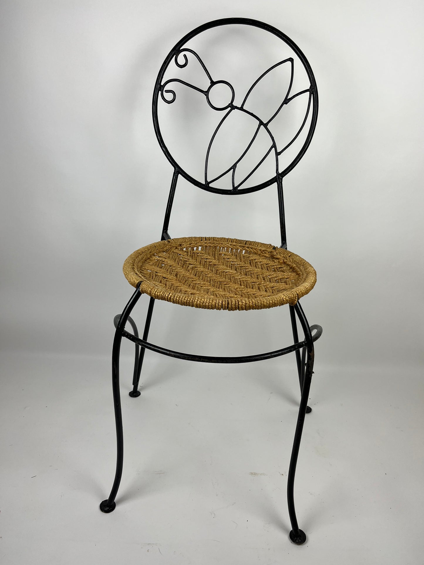 A PAIR OF WROUGHT IRON 'BUTTERFLY' DESIGN CHAIRS